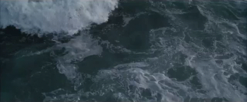 a person surfing on waves in the ocean