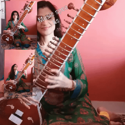 the woman is playing an instrument in front of a purple background