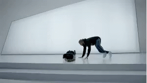 a person bending over on the floor in a room