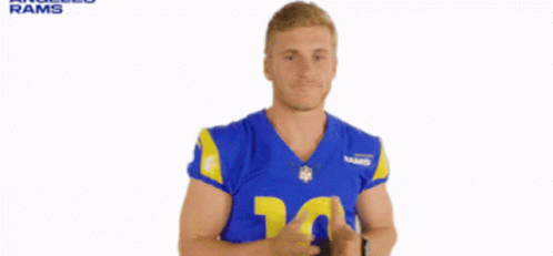the blue - clad nfl player poses for an ad