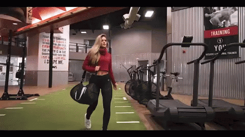 woman running on a treadmill in a gym