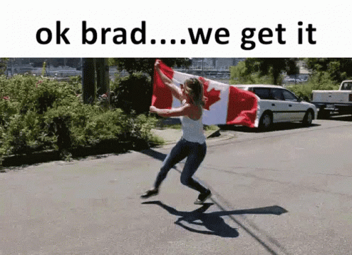 the person is running with a canadian flag