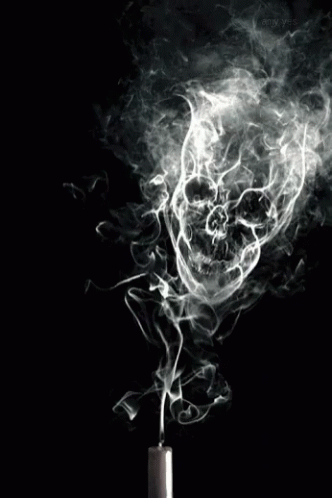 a white skull on a black background smoke