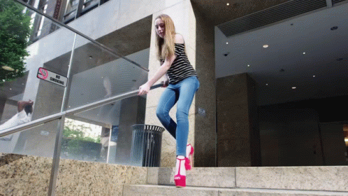 a woman dressed as zombie walking down the stairs