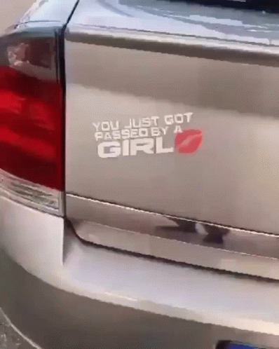 this truck has an oval sticker that reads you just got passed the girl