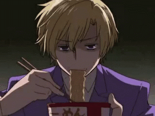 a male anime holding an asian soup pot
