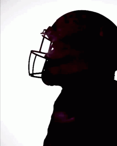 a silhouette pograph of the nfl helmet of a football player