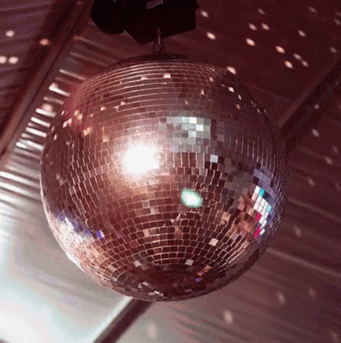a disco ball that is hanging from a ceiling