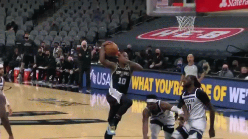 there is a basketball player about to slam the ball