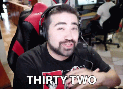 a man with headphones on with a text saying thirty two