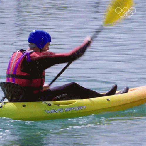 the surfer in a wet suit has blue raft