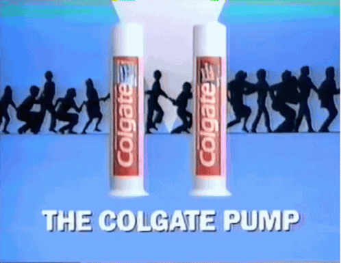 two tubes of colgate pump with silhouettes of people in the background