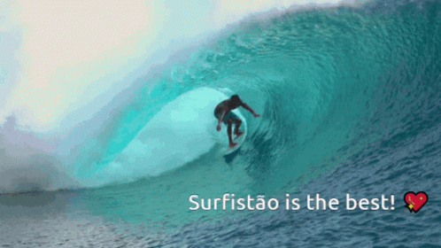 man riding a giant wave while surfing in the ocean