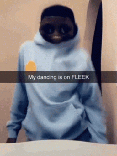 a person with a weird hoodie that has the words dancing is on fleek in front of him