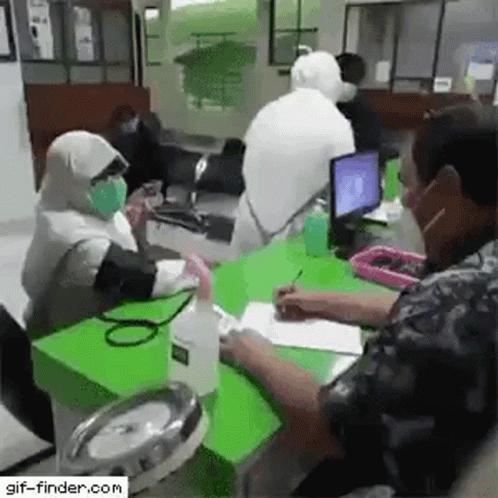 this is an image of people wearing masks in the office