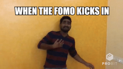 a man with his hand on the wall, saying when the fomo kicks in