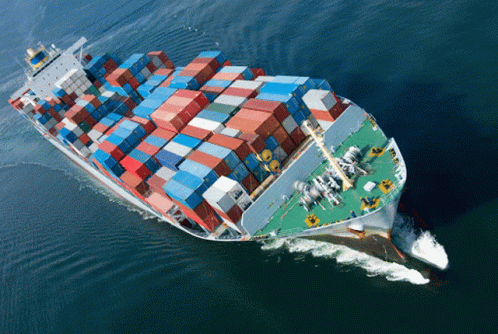 an image of a cargo ship sailing in the ocean