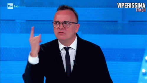 a man with glasses giving the finger sign