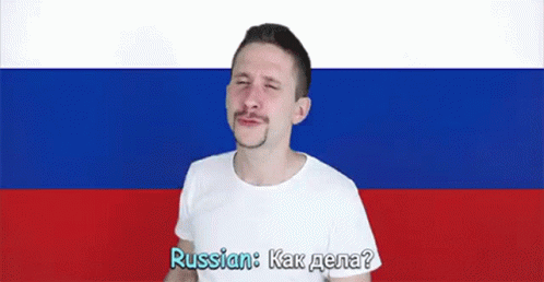 man standing in front of an russian flag