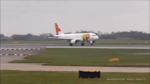 an airplane landing on the runway and turning it