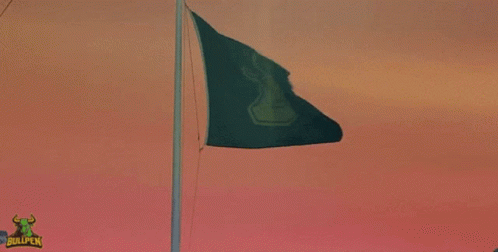there is an image of a flag waving at dusk
