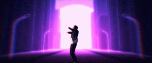 person in front of purple light with his arms up