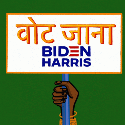 someone holding a sign with a blue hand and the words biden harris