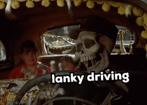 a large skeleton in a car with words that say stink driving