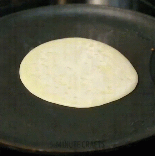 an image of an omelet being cooked in a pan