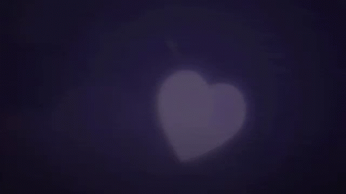 a silhouette of a heart against a foggy background