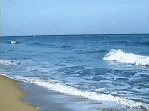 an image of a beach scene with waves