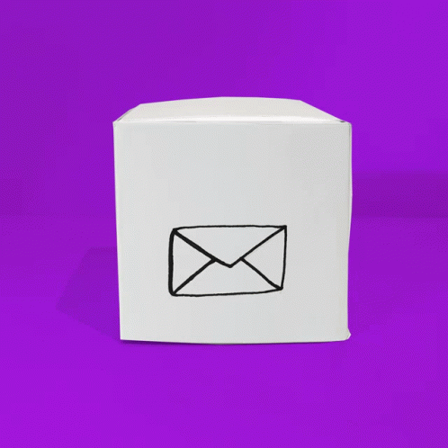 an envelope is on the side of a white box