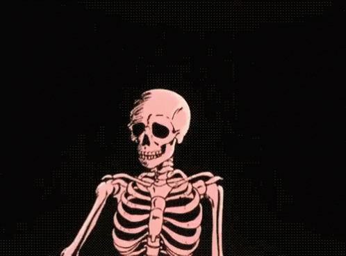 a skeleton is sitting down holding onto soing