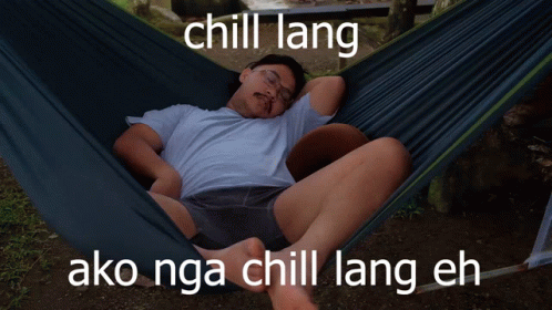 a man laying in a hammock with the words chill lang on it