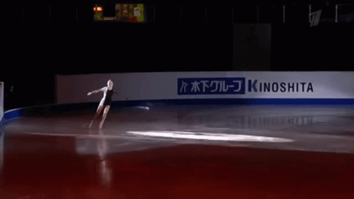 a person skating in a rink on ice
