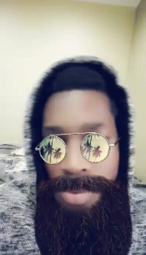 a man wearing sunglasses and a fake beard