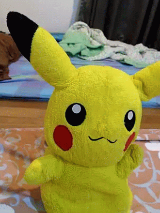 a stuffed animal toy in the shape of a pikachu