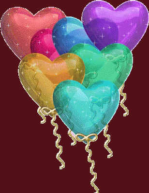 a bunch of heart shaped balloons in the air