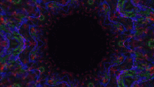 a picture of a black hole with a colorful background
