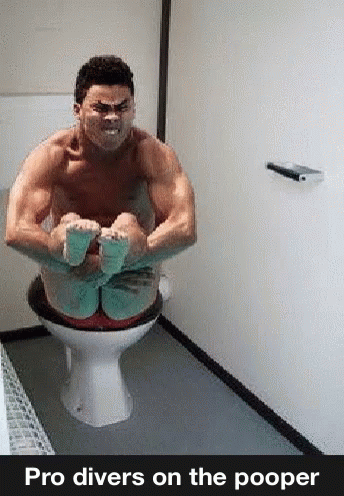 a man on a toilet with some gloves