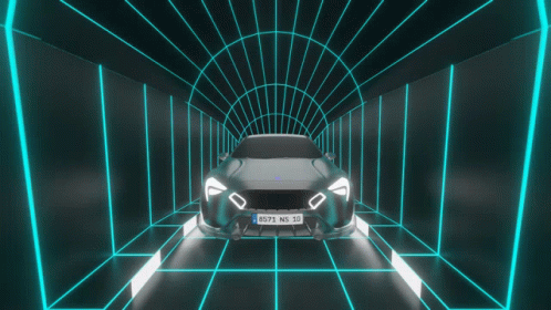 a car is in a tunnel while neon lights show up
