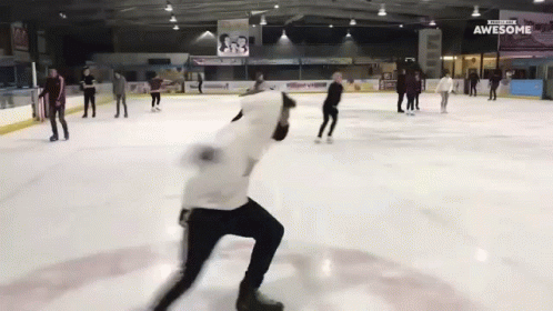 people skate on an ice rink during winter