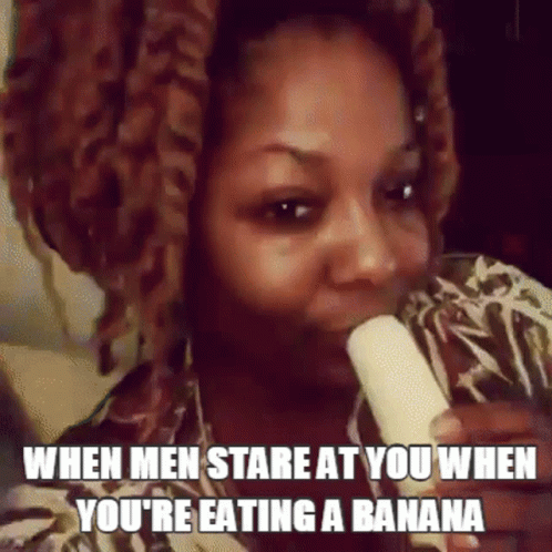 a picture of a woman with the text saying when men stare at you when you're eating a banana