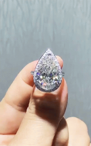 someone holding a piece of diamond in their hand