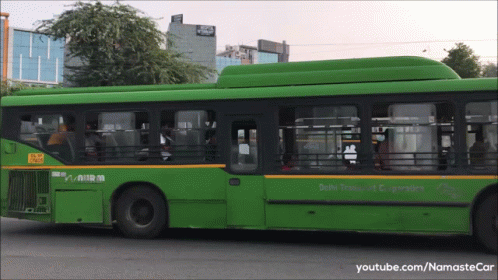 a passenger bus with its door open parked on the side of a road