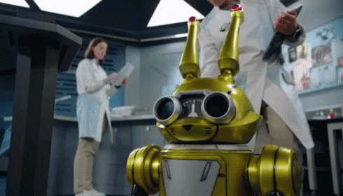 two robot men in lab uniforms near each other