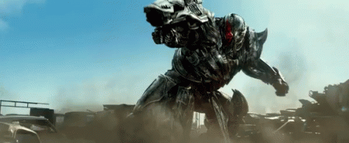 an image of a giant robot like creature standing by a truck