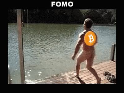 the young man is on the dock holding a bit coin