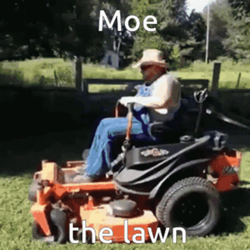 a man riding a lawn mower on top of green grass