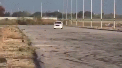 a bus driving on the road in a deserted area
